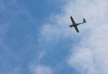 small plane flying low in the sky with space for text