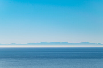 Obraz premium a blue sky landscape across the Mediterranean Sea at the northern coast of Africa 