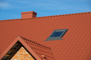 New roofing construction with attic skylights, rain gutter system, roof windows and roof protection from snow board, snow guard exterior