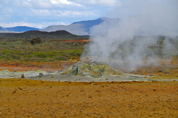 Supernatural landscape at geothermal field Mars like site Hverir Namafjall wasteland with pools of...