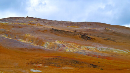 Supernatural landscape at geothermal field Mars like site Hverir Namafjall wasteland with pools of...