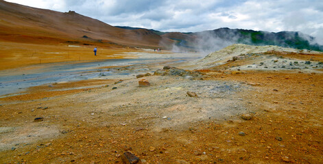 Supernatural landscape at geothermal field Mars like site Hverir Namafjall wasteland with pools of...