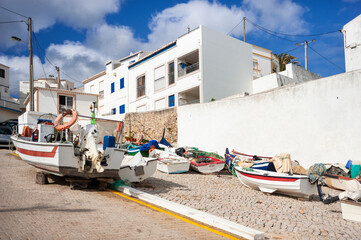 Fishing boats in the village centre of Burgau in the Algarve