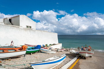 Fishing boats in the village centre of Burgau in the Algarve
