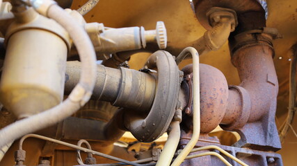 Turbocharger of heavy machinery. Old diesel engine  turbine for boosting torque with parts in the bottom view. Selective focus