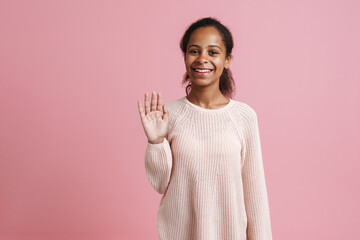 Brunette black girl smiling and looking at camera