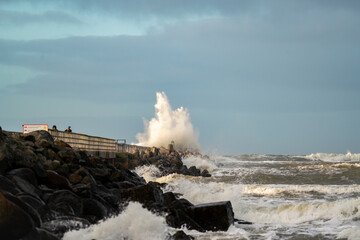 Beach of norre vorupor, denmark, stormy day and the waves break over the pier