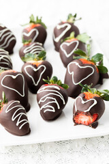 Chocolate covered strawberries on a bright white platter for Valentines Day.