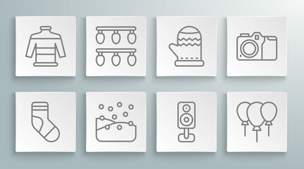 Set line Christmas stocking, lights, Snowfall, Stereo speaker, Balloons with ribbon, mitten, Photo camera and sweater icon. Vector