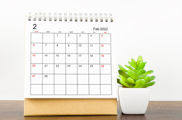 February 2022 desk calendar with plant pot.