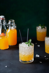 cocktail with fresh mandarins, crushed ice and mint leaves