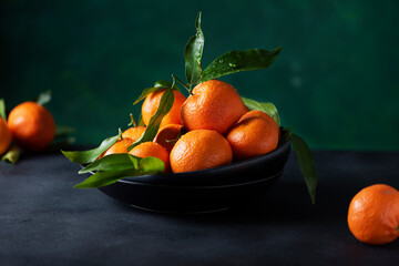 Fresh mandarins with green leaves