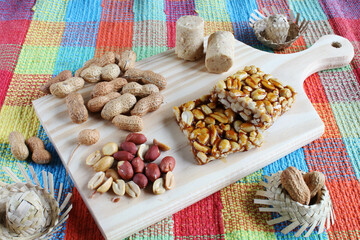 Desserts made of peanuts and nuts on the wooden board