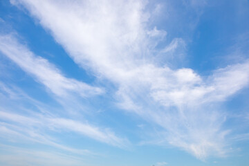 Naklejka na ściany i meble Blue sky with small white clouds for background usage.