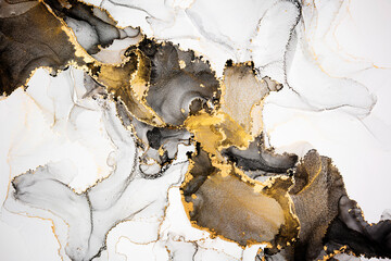 Luxury abstract fluid art painting in alcohol ink technique, mixture of black, gray and gold paints. Imitation of marble stone cut, glowing golden veins. Tender and dreamy design. - 481394386