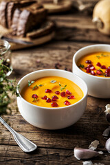 Homemade Pumpkin soup and toast of white bread, top view