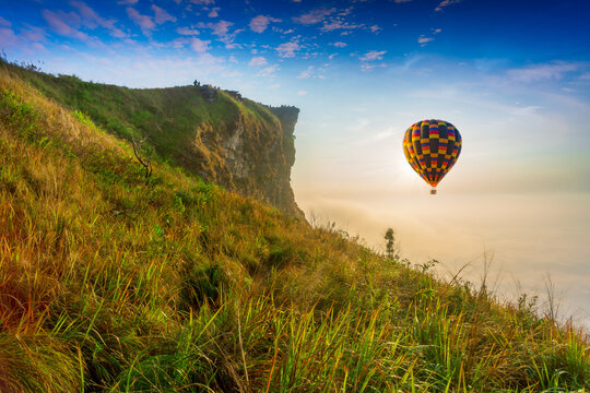 Colorful hot air balloons flying over mountain at Dot Inthanon in Chiang Mai, Thailand. 