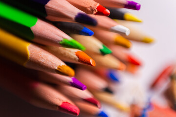 Fototapeta premium macro photo of multicolored pencil leads on a white background