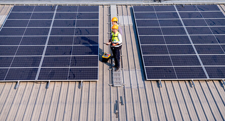 Engineer wearing unifrom and helmet inspect and check solar cell panel ,solar cell is ecology...