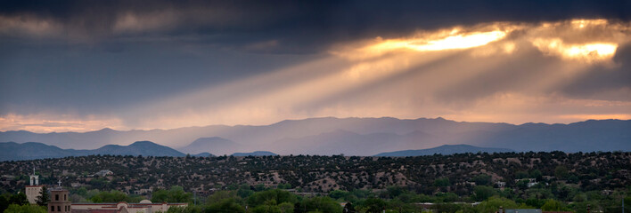 This beautiful sunset landscape view in Santa Fe New Mexico ephasizes the layers of light in the...