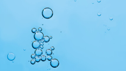 oil with bubbles on dark blue background. Abstract space background. Soft selective focus. macro of oil drops on water surface. copy space. air bubbles in water
