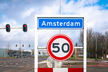 Location sign of the city of Amsterdam, The Netherlands. Sign below means speed limit in zone is 50.