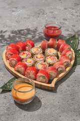 Heart shaped set of sushi rolls for Valentine's Day. Menu or delivery concept with space for text