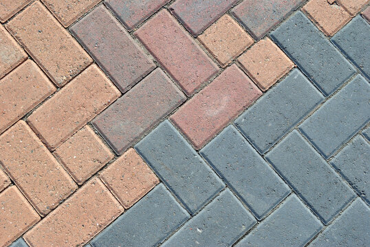 Close Up of Coloured Blocks in Concrete Pavement 