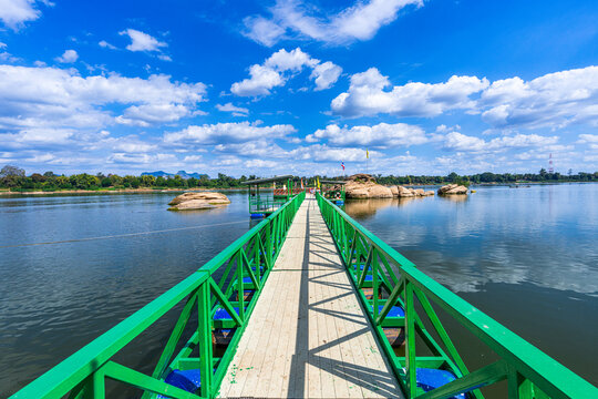 A bridge leading to the Buddha's Footprint in the middle of the Mekong River in Tha Uthen District, Nakhon Phanom Province, Thailand