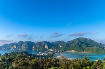 Fototapeta premium view from Top Viewpoint of Phi Phi island is Andaman Paradise tropical island with clear blue sea water and white send beach over Tonsai beach, Dalum bay. Krabi, Thailand.