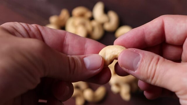 Cashew nuts isolated on wooden background