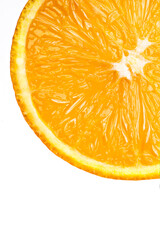 Slice of orange on white background