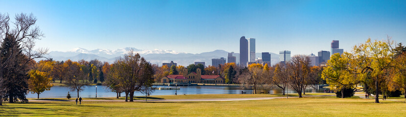 Panoramic view of downtown Denver Colorado from City Park in Fall with the Rocky Mountains in the background