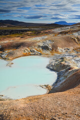Acid hot pond in Leirhnjukur, or Mud Peak, a 525m high active volcano in the Krafla caldera, surrounded by lava fields, mud pots and fumaroles. Northern Iceland