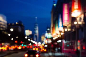 Fotobehang New York Blurred night lights of a New York City street scene at Chelsea Piers in Manhattan  © deberarr