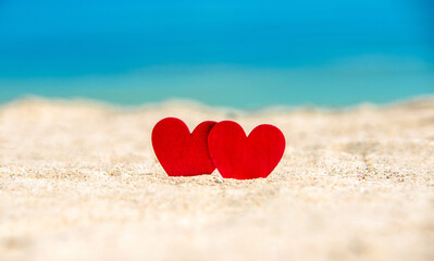 romantic symbol of two hearts on the beach
