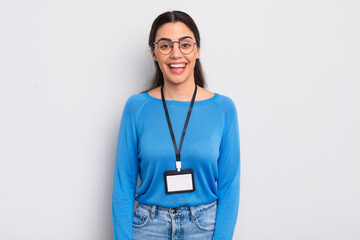 pretty hispanic woman looking happy and pleasantly surprised. accreditation concept