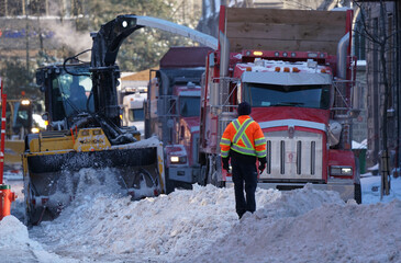 Snow removal crews cleaning city streets. - 481409767