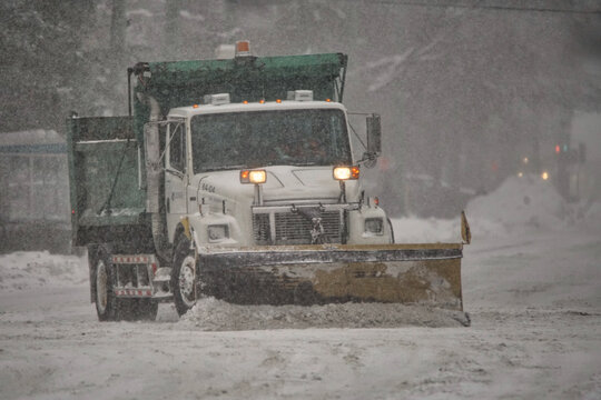 Snow removal crews cleaning city streets.