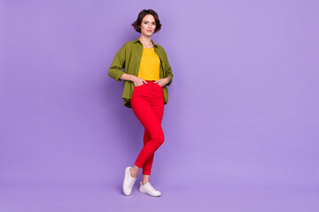 Full size photo of young pretty woman wear modern clothes standing isolated over violet color background