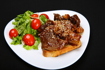 Steak. Beef on toast with demiglace sauce