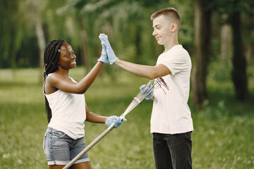 Two young excited volunteers giving high five