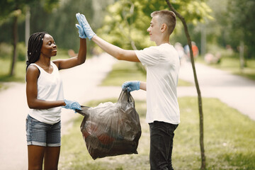 Two young excited volunteers giving high five