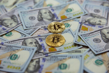 Bitcoin against the background of dollar bills. exchange bitcoin for dollars. fall of bitcoin