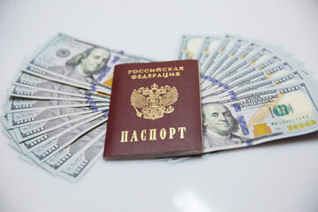 passport and hundred-dollar bills