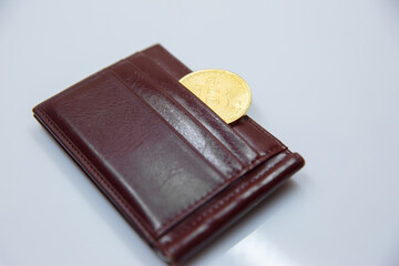 Bitcoin in purse on a white background. Isolated.