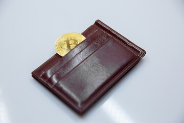 Bitcoin in purse on a white background. Isolated.