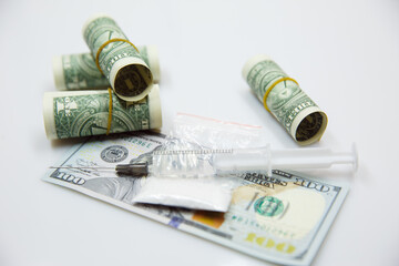 drug addiction, crime, drug abuse and substance abuse. dollars, drugs, syringe.