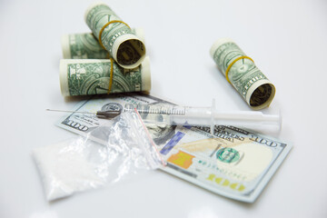 drug addiction, crime, drug abuse and substance abuse. dollars, drugs, syringe.