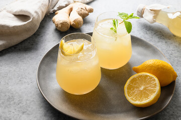 Homemade healthy kombucha beverage glasses with lemon. Organic probiotic drink.
